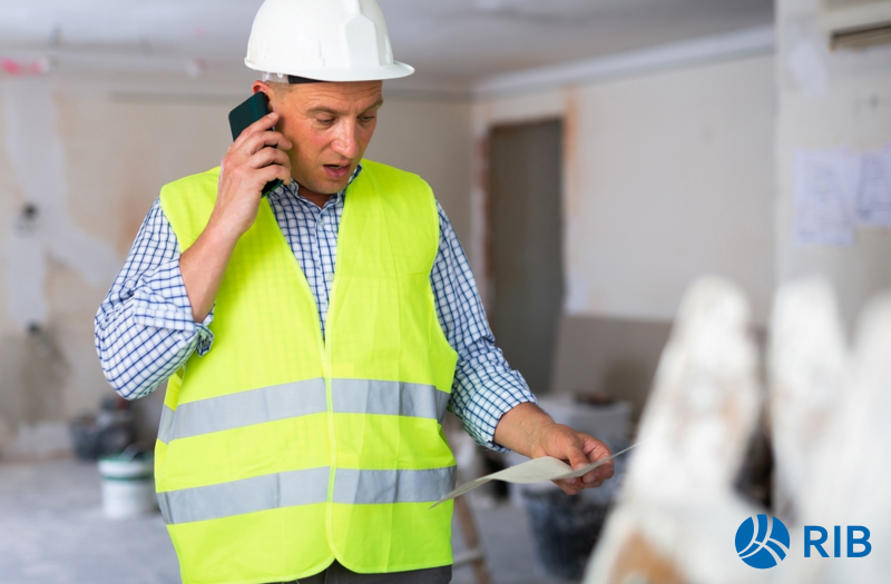 Rising Cost in the Construction Industry - Construction worker on the phone looking concerned